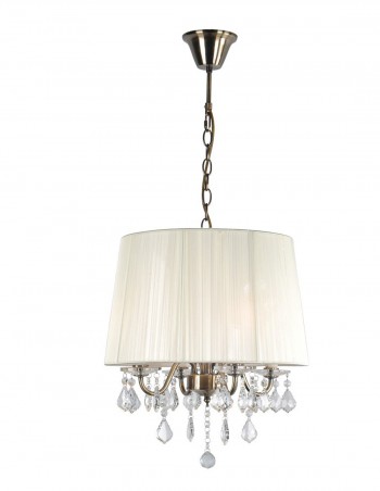 Lámpara color dorado con pantalla de hilo beige.